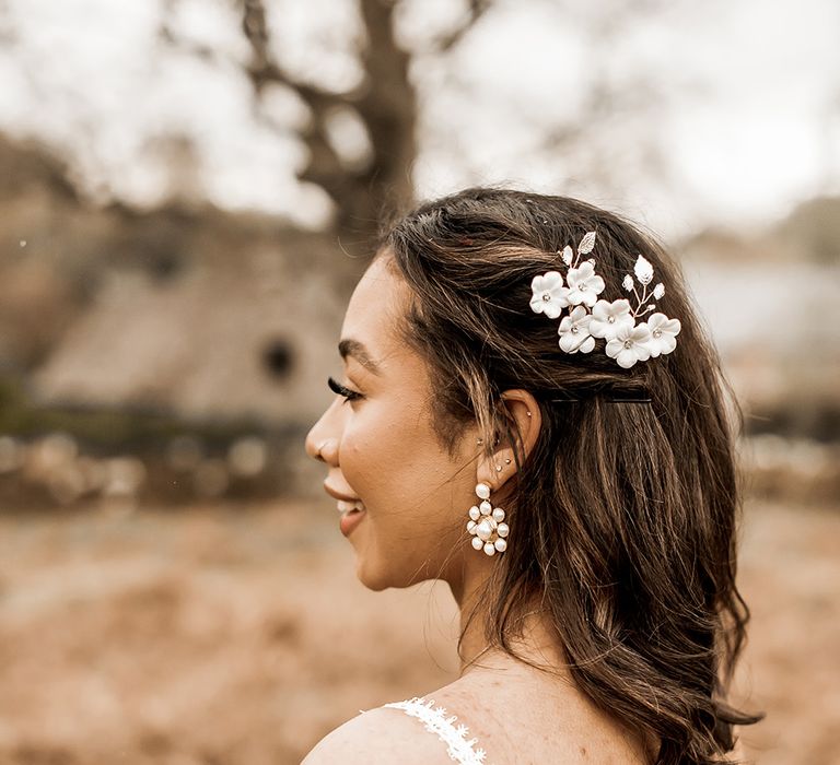 Bride with short bobbed hair with floral hair slide and earrings 