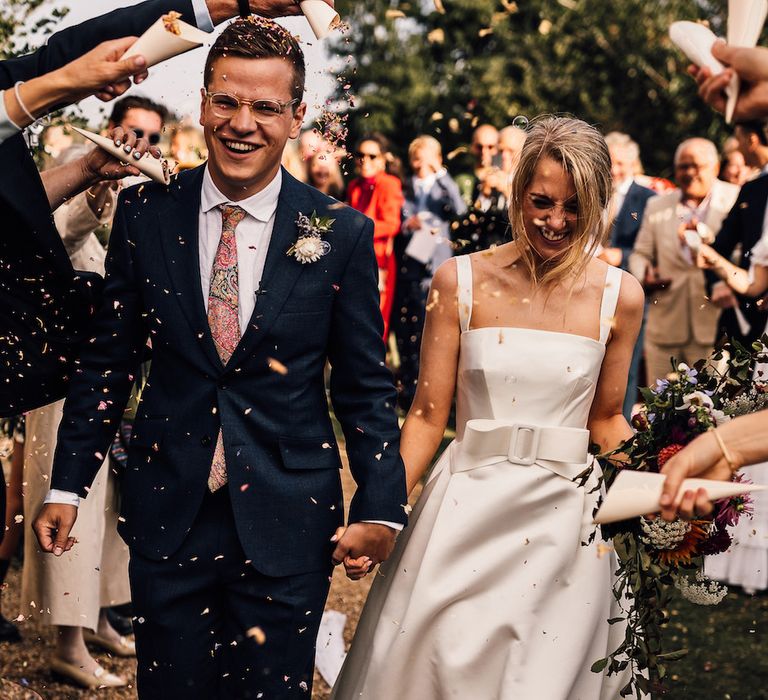 Confetti moment for bride and groom 