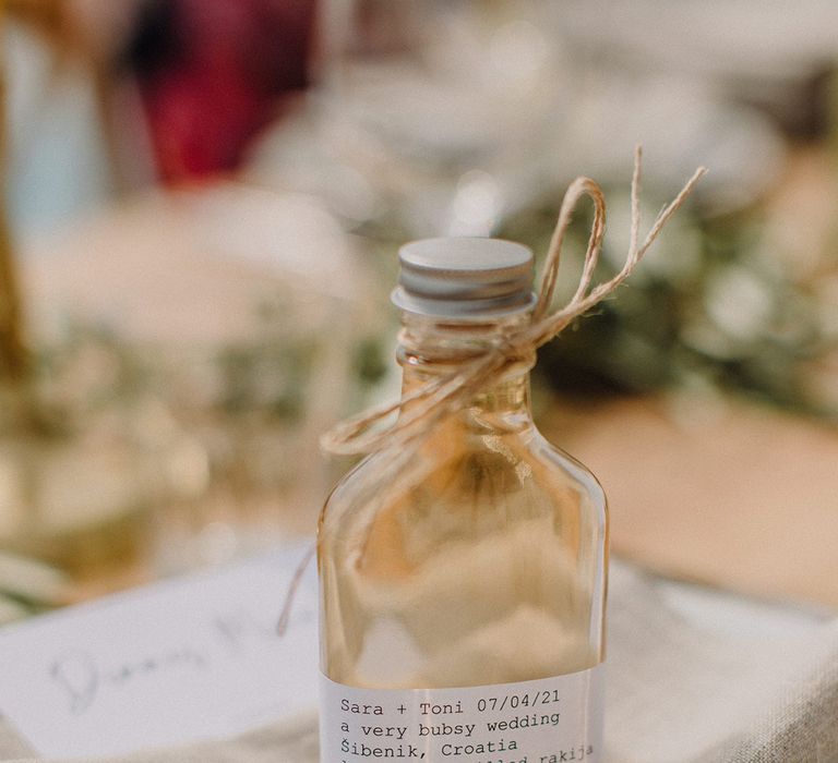 Small bottle of locally distilled rakija tied with string as wedding favour