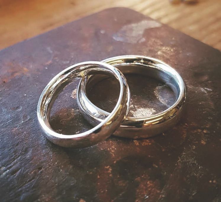 Finished product of make your own wedding ring course - two polished wedding bands