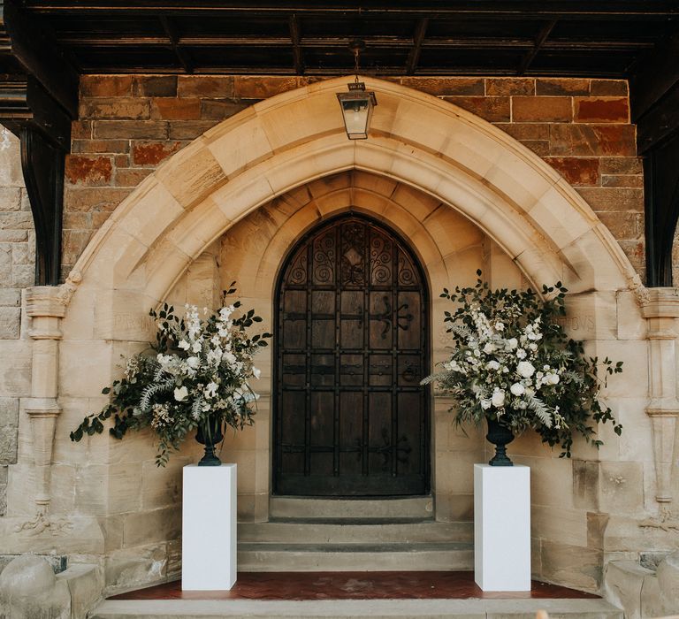 White flower arrangements at outdoor wedding