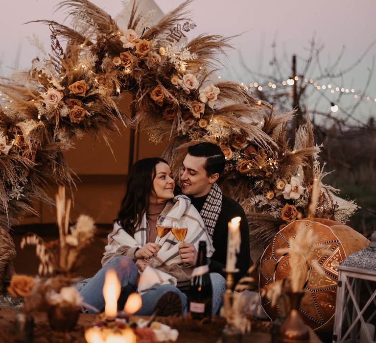 Boho bell tent wedding proposal with fairy lights and dried wedding flower decor 