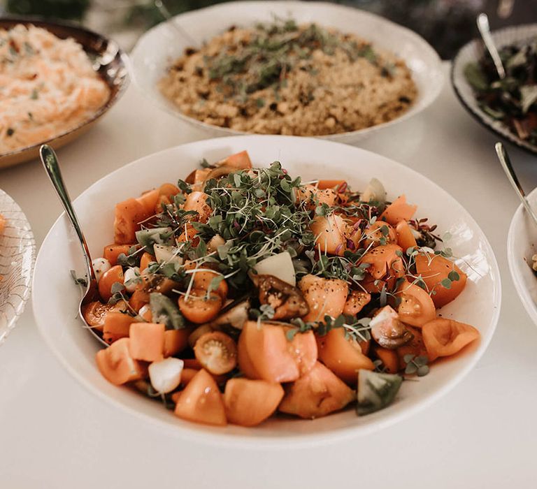 Salads in white bowls for buffet wedding reception 