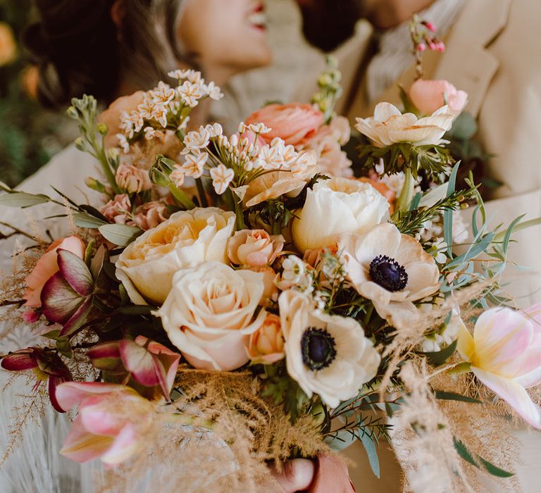 blush pink and peach rose and anemone wedding bouquet 