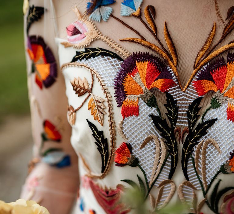 Close up of the colourful flower detail on the Temperley Bridal wedding dress