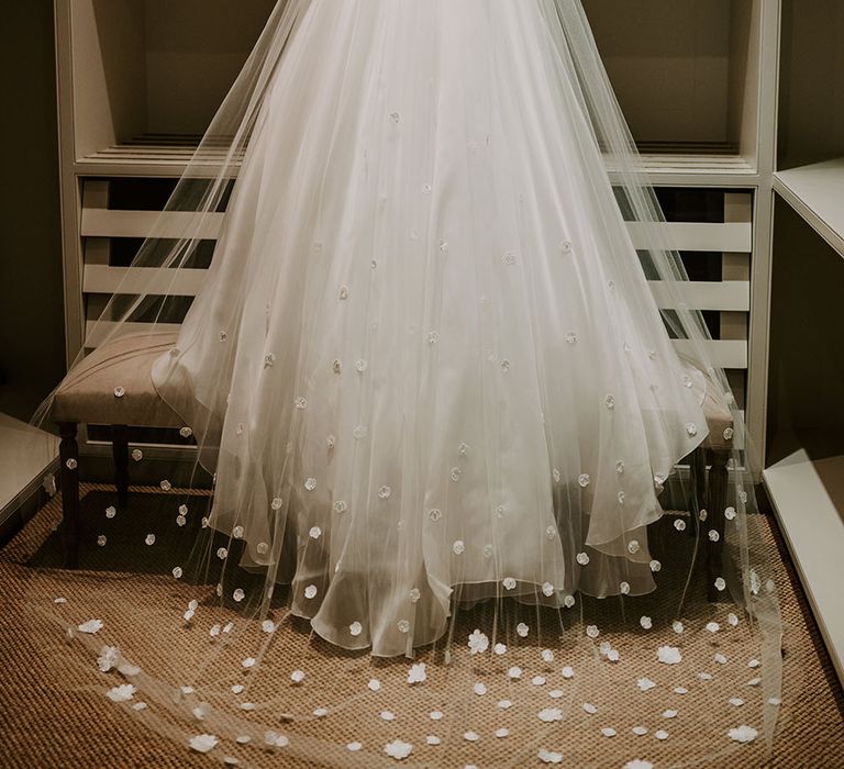 Floor-length veil complete with appliqué flowers  