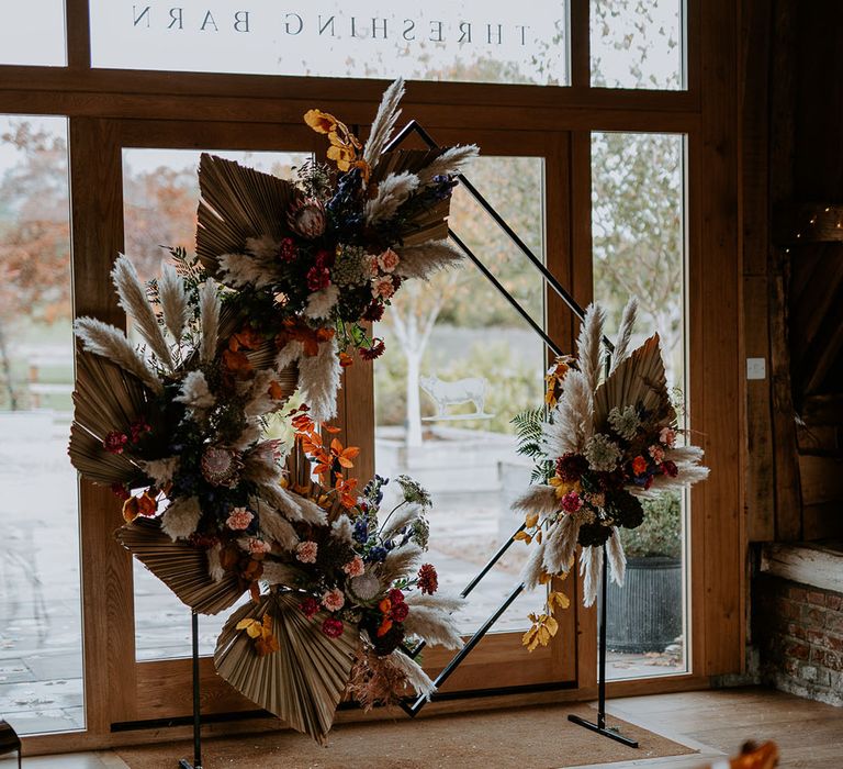 Diamond altar decoration with dried palm leaves, pampas grass and colourful flowers 