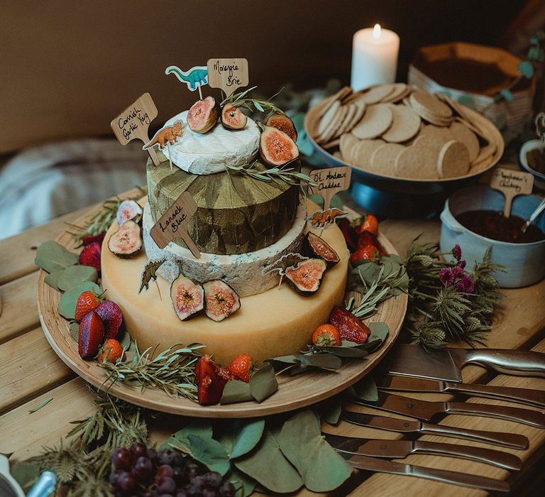 Wedding cheese tower wedding cake alternative with crackers and chutney with dinosaur decor 