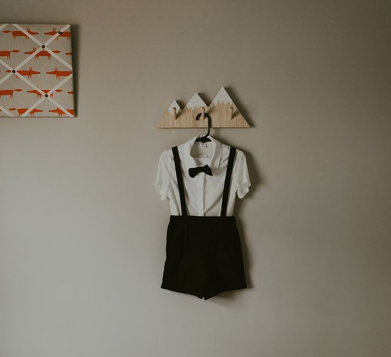 Cute page boy outfit with black bow tie, shorts, braces, and shoes with a white shirt 