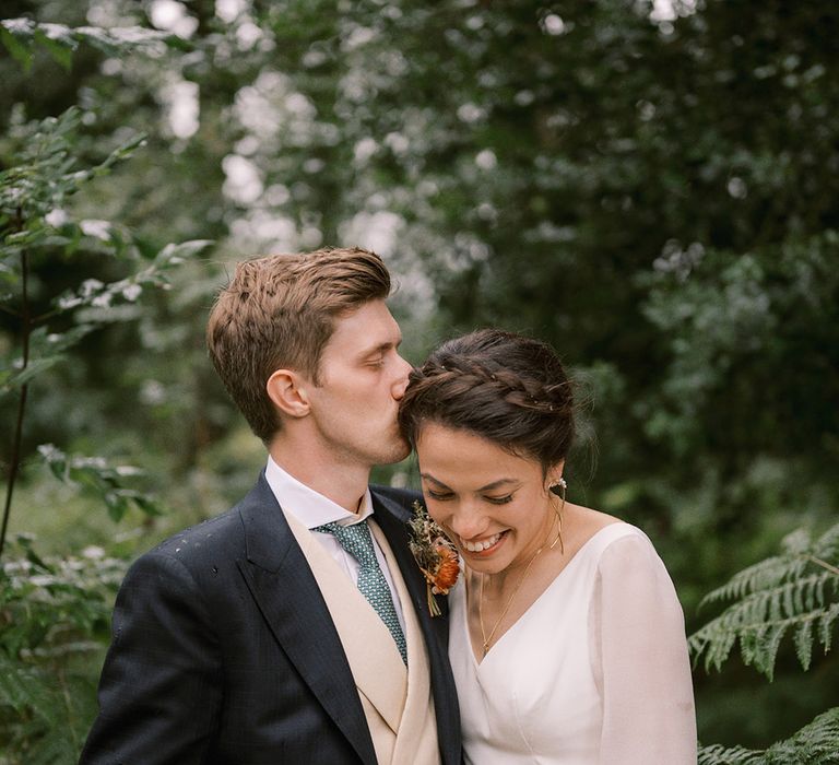 Coombe Trenchard wedding with the bride and groom posing for their couple portraits