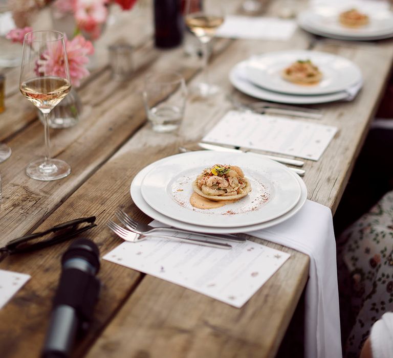 Plates full of a delicious wedding breakfast for the summer wedding in Devon 