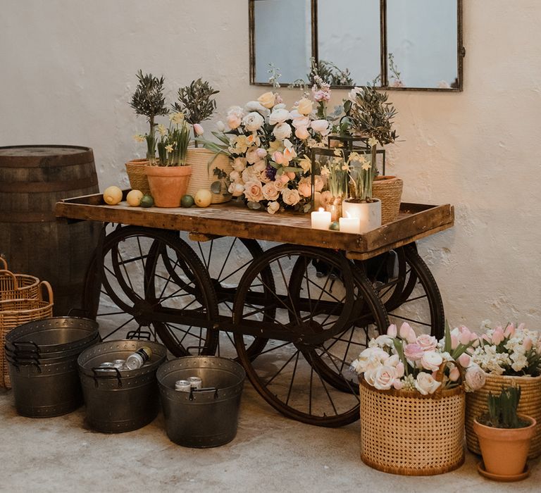 Colourful pastel wedding flowers on wooden boxes for decoration at The Cowshed Crail 