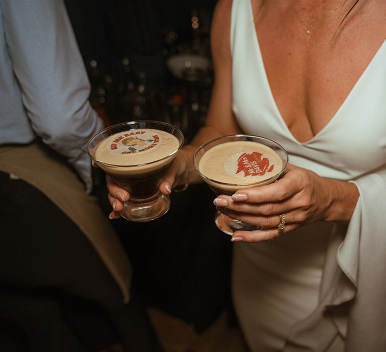 Bride holding espresso martini wedding cocktail with personalised edible toppers 