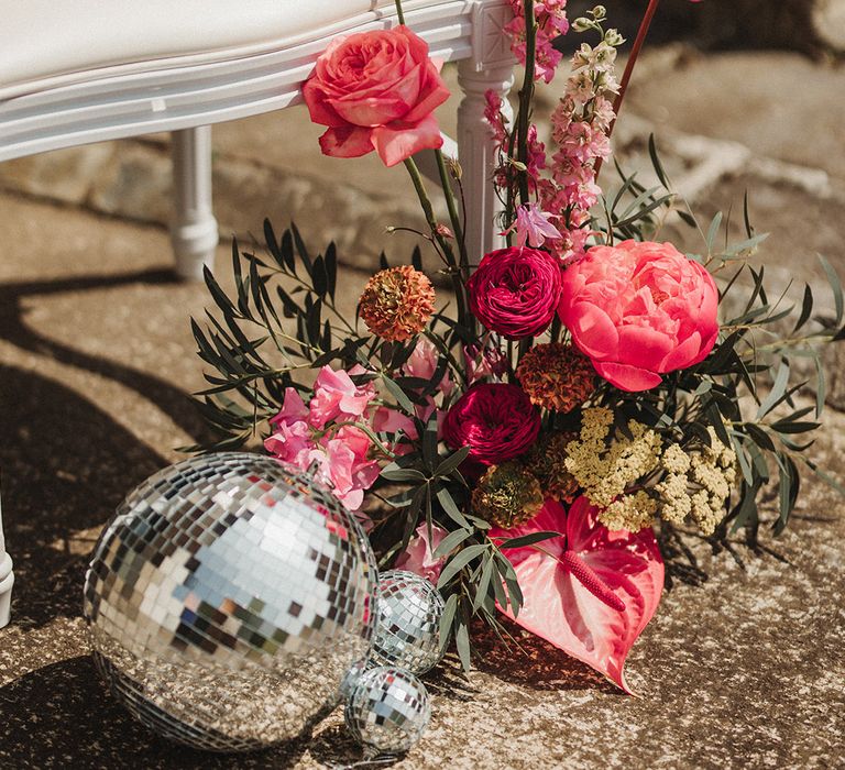 Anthuriums, roses and more in hot pink wedding flower arrangement at country house wedding in Cornwall 