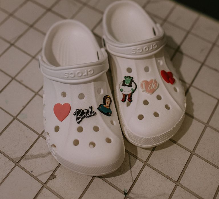 White Crocs for the bride with Shrek Jibbitz and charms for the wedding reception 