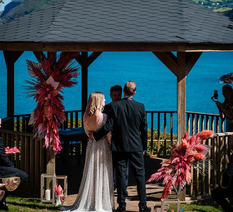 Watermouth Cove wedding ceremony at coastal wedding 