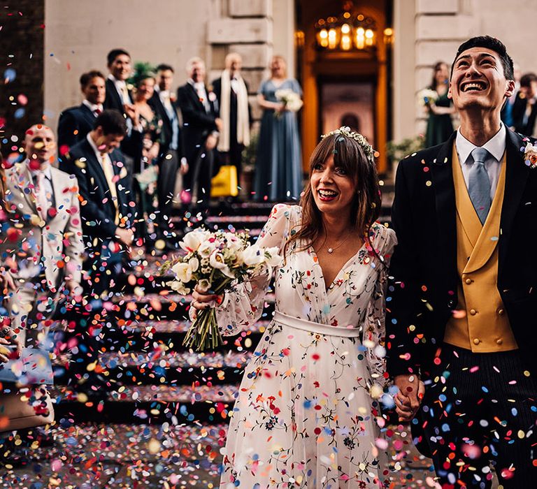 Colourful confetti exit for the bride and groom 