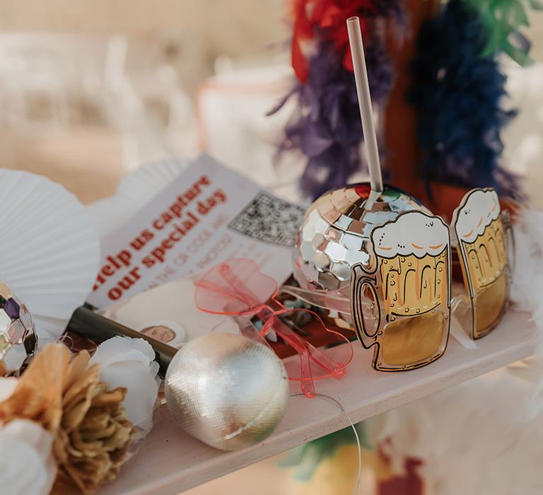 Props for wedding pictures with funky sunglasses and disco ball cups 