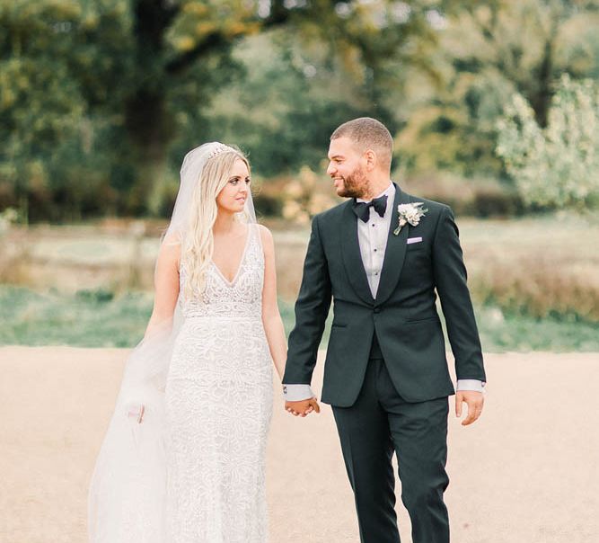 Bride in Made With Love wedding dress and groom in tuxedo at black tie winter wedding