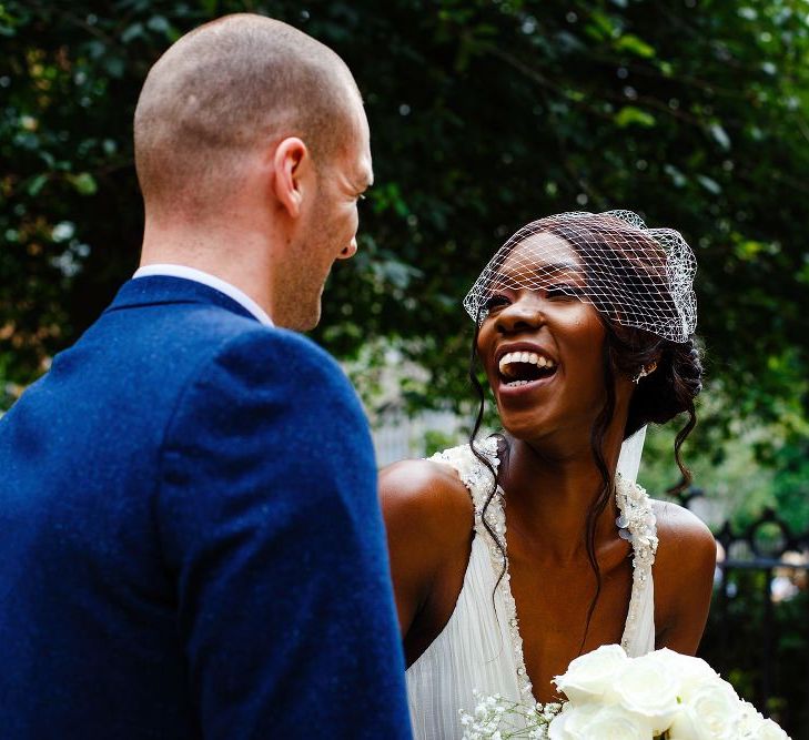 Bride wearing a birdcage veil