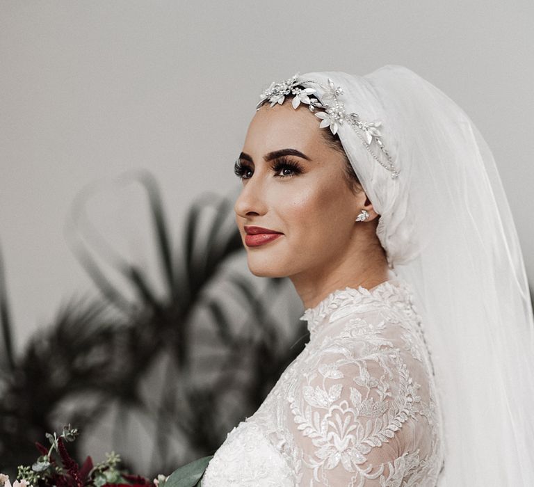 Beautiful Islamic bride in Enzoani wedding dress with long sleeves