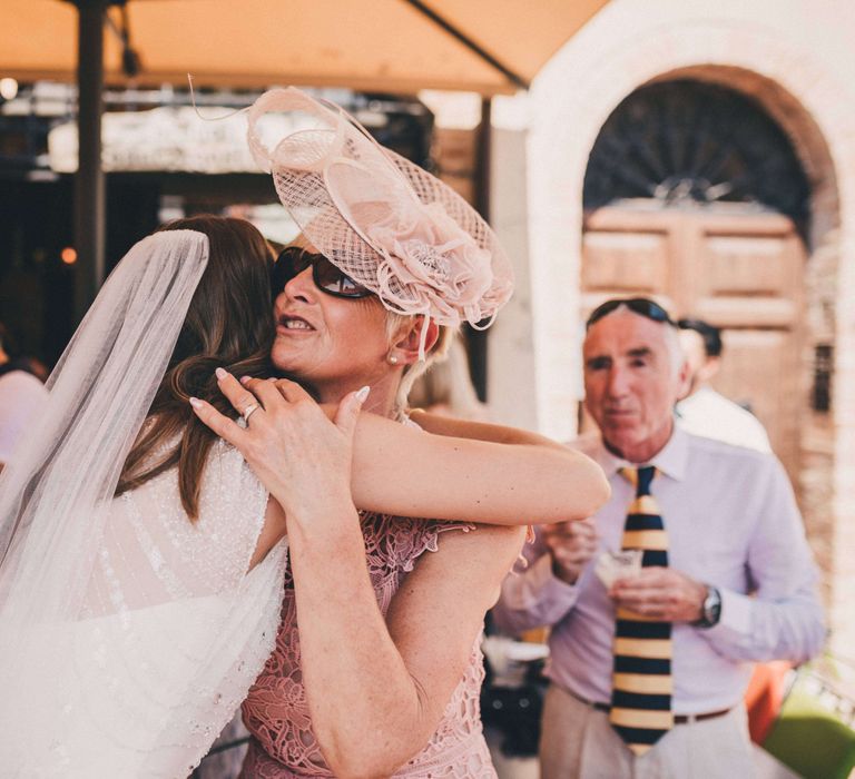 Bride hugging mother of the bride at Italy wedding 