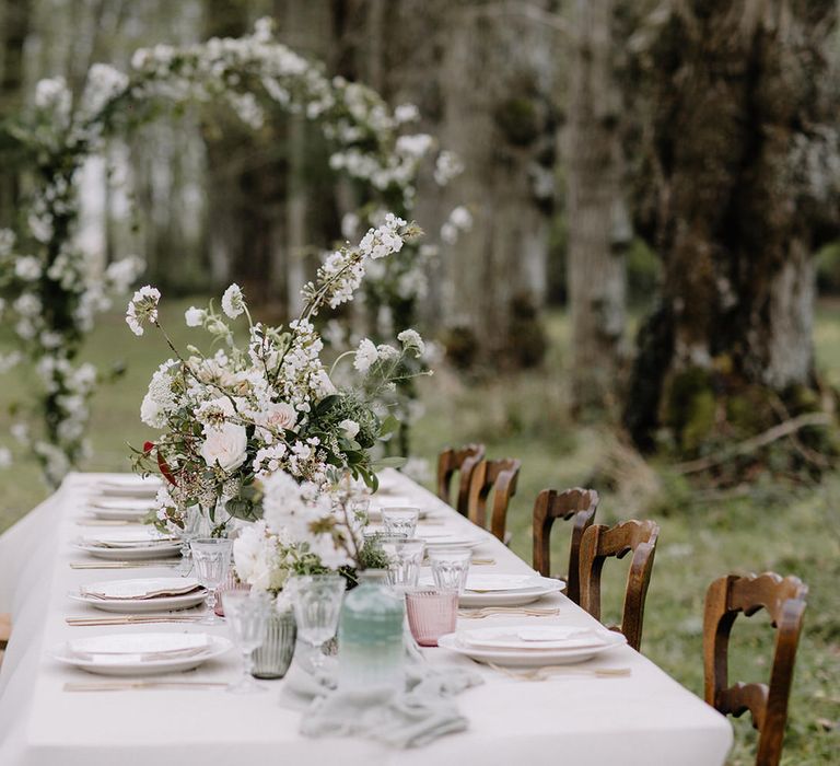 Outdoor fairytale woodland wedding dining table at Chateau de la Ruche