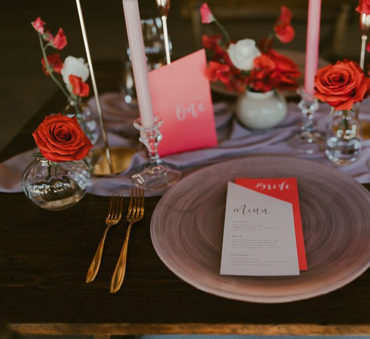 Coral inspired stationery placed upon modern plate 