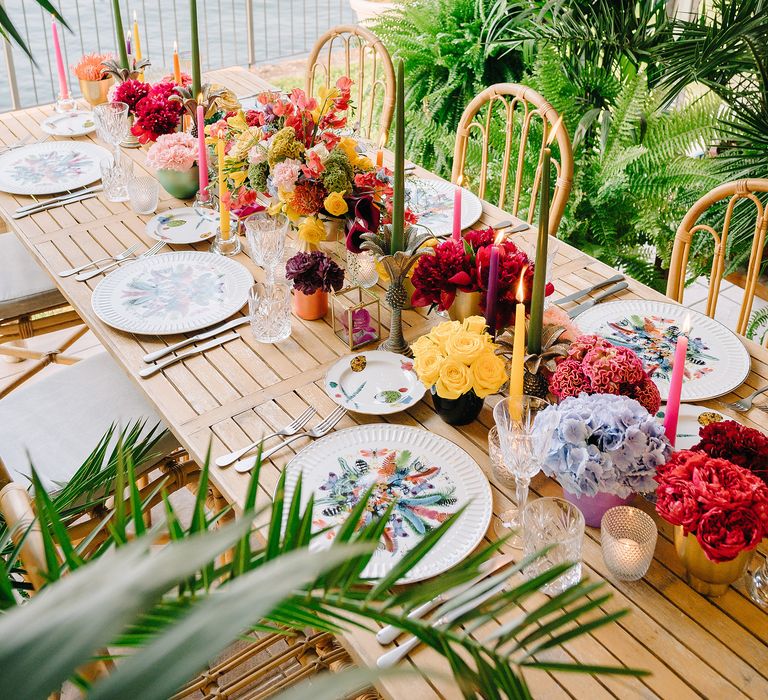 Colourful bouquets line table in vibrant Lake Como wedding