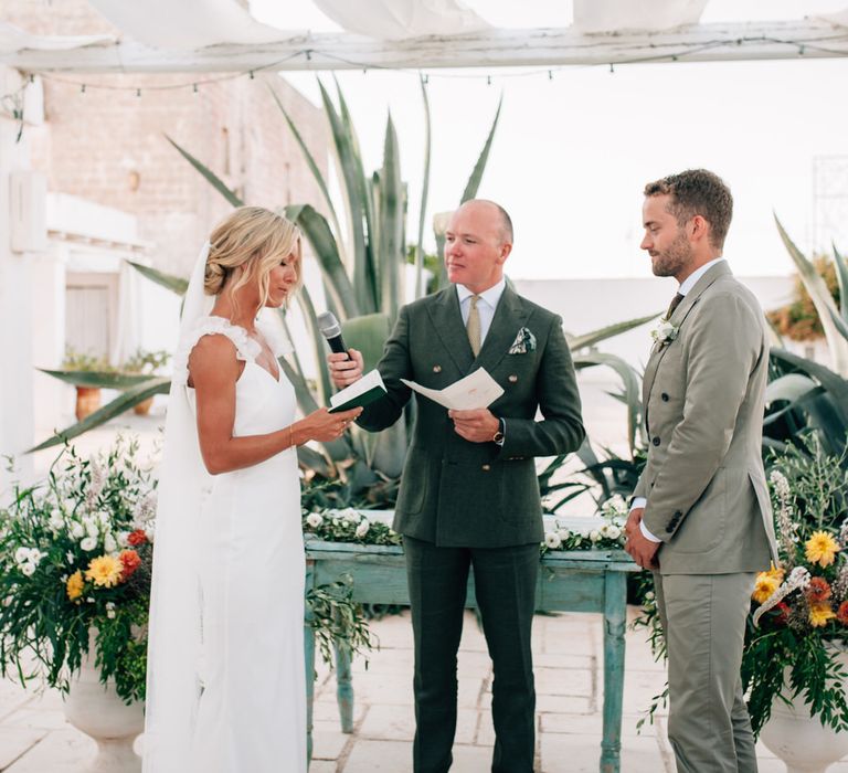 The bride and groom reciting their vows