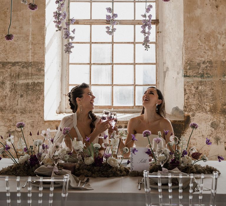 Hanging flower stem installation and wild flower centrepiece with moss