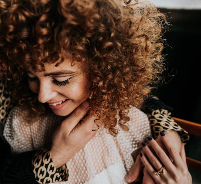 Beautiful bride with freckles and naturally curly hair for 70s wedding inspiration