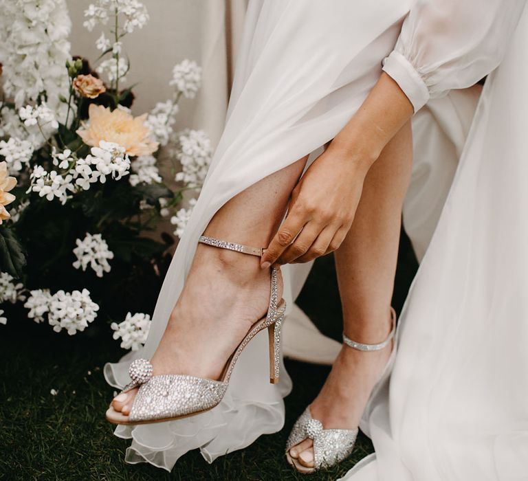 Bride in silver diamanté peep toe wedding shoes