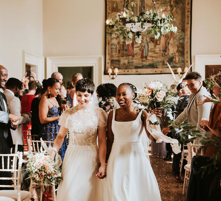 LGBTQI+ wedding at Elmore Court with Black African bride in a Essense of Australia wedding dress and bride with short hair in a Ana Kara bridal gown 