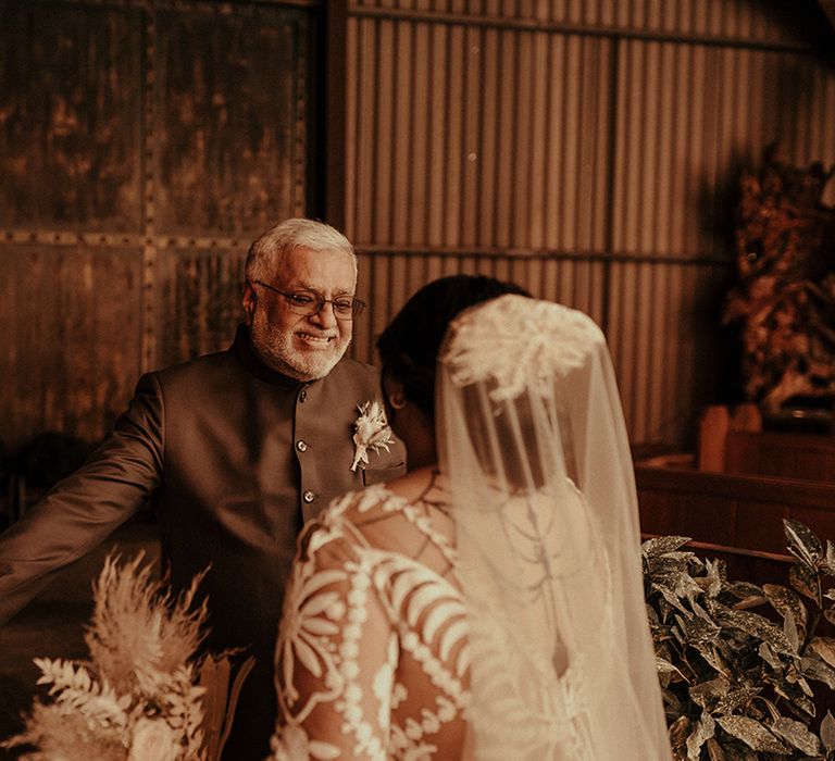 Father of the bride first look with his daughter in a lace Ruse de Seine wedding dress 