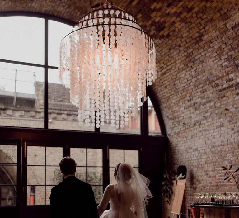 Circular chandelier at industrial city venue at 100 Barrington, Brixton 