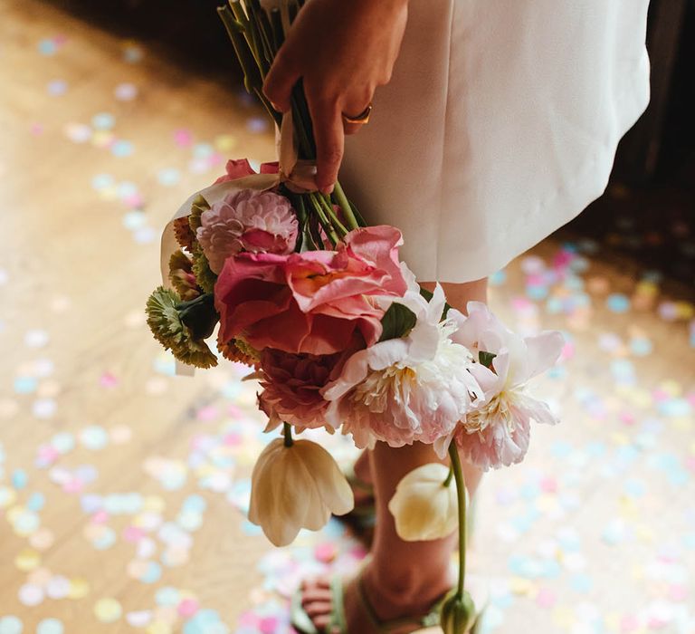 Bridal bouquet with pink peonies and roses, white tulips and dahlias 