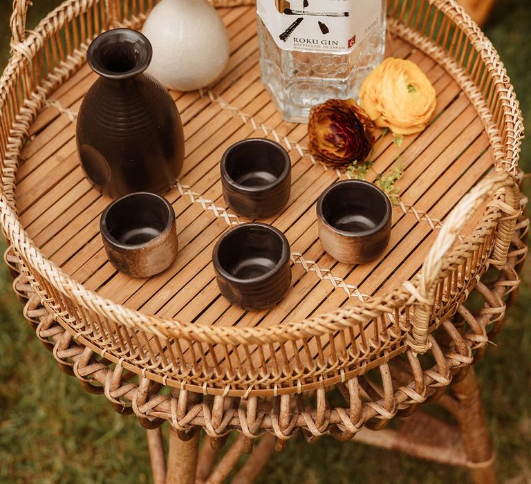 Roku Gin and san Ku do nuptial cups on a bamboo table at Japanese wedding inspiration 