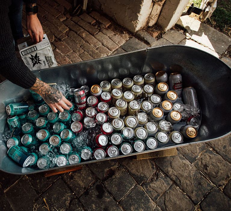 Steel water trough filled with beer and ice 