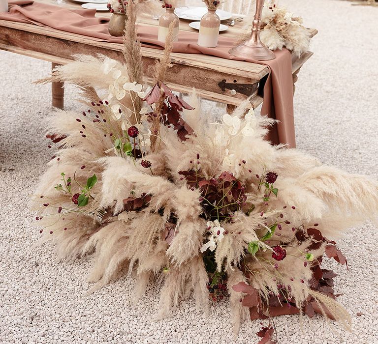 Pampas grass installations complete with neutral toned florals 