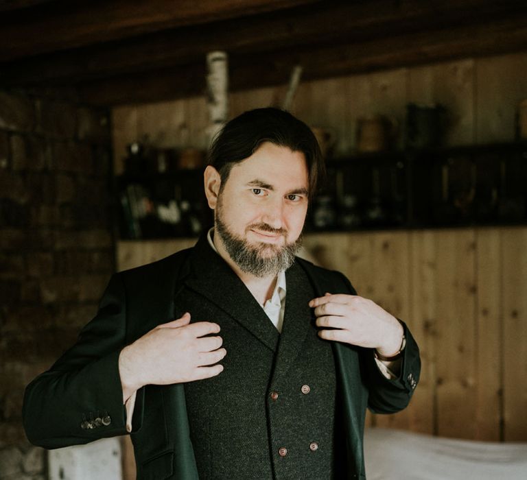 groom in wool double breasted waistcoat on the wedding morning 