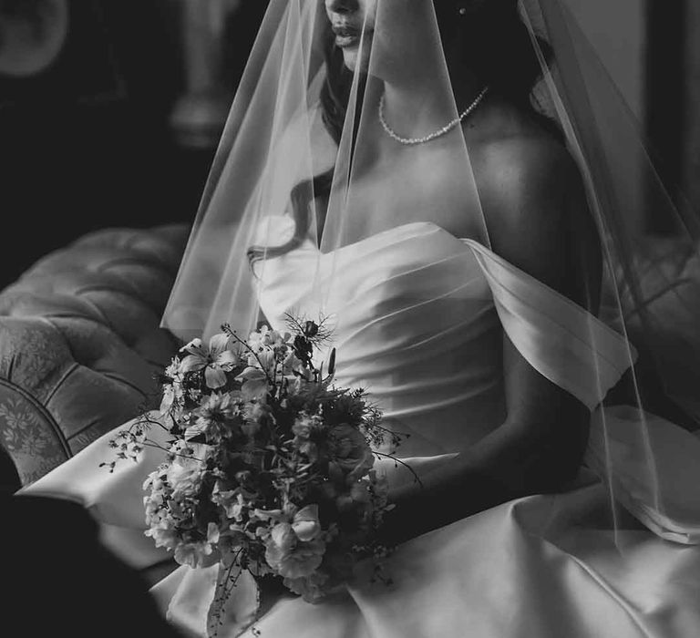 bride in a strapless wedding dress with wedding veil bridal accessory 