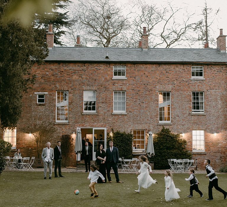 Aswarby Rectory country house wedding venue with children playing football