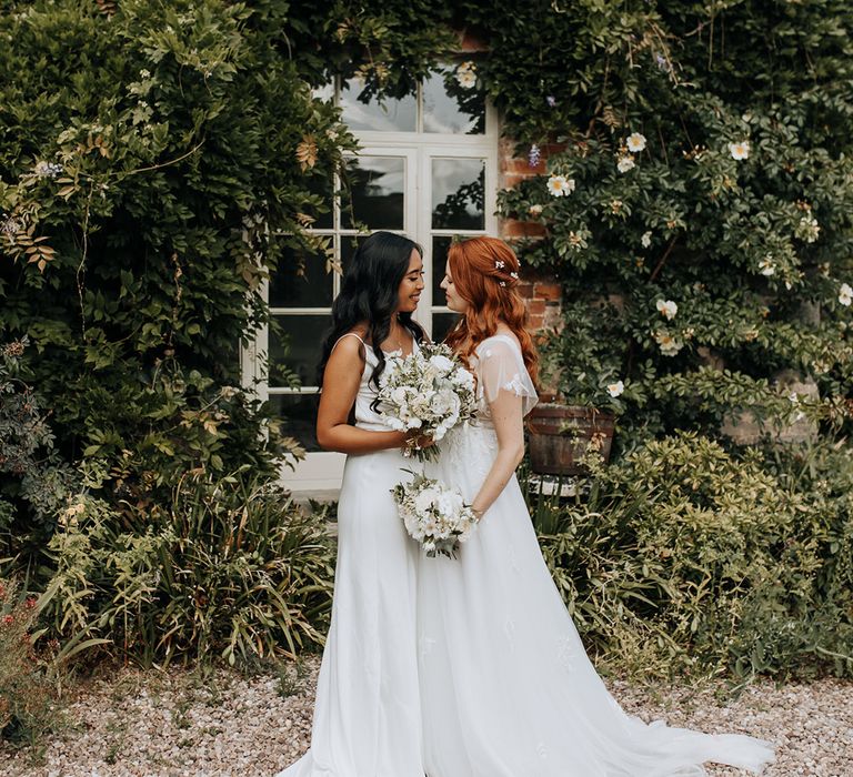 Lyde Court wedding with two brides standing together for stunning couple portrait 