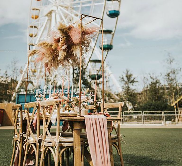 Fairground themed wedding entertainment with table set up and big wheel