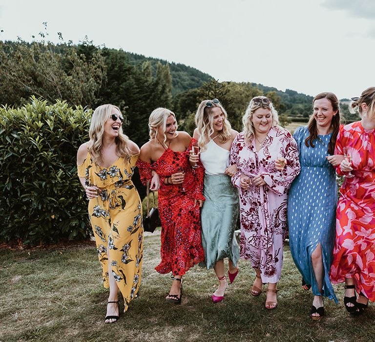 Wedding guests wearing colourful and patterned outfits 