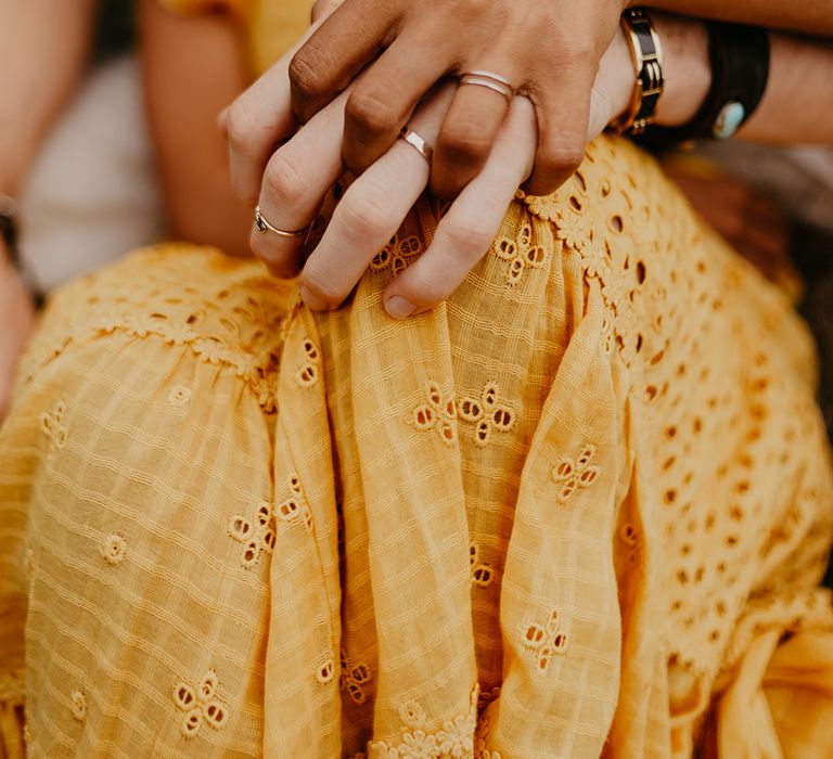 Bride and groom holding hands 