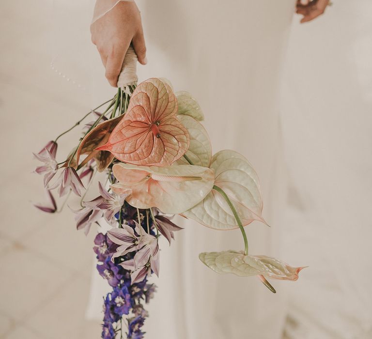 Wedding bouquet with anthurium and purple stocks