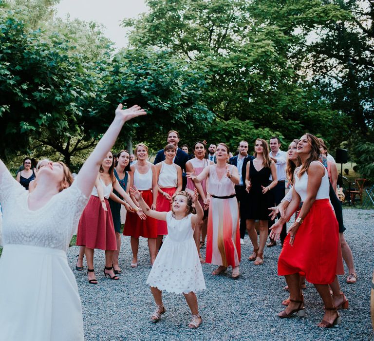 Bride throwing her bouquet 