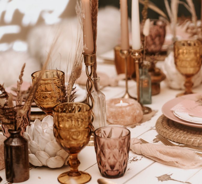 Neutral candlestick tablescape with pampas grass